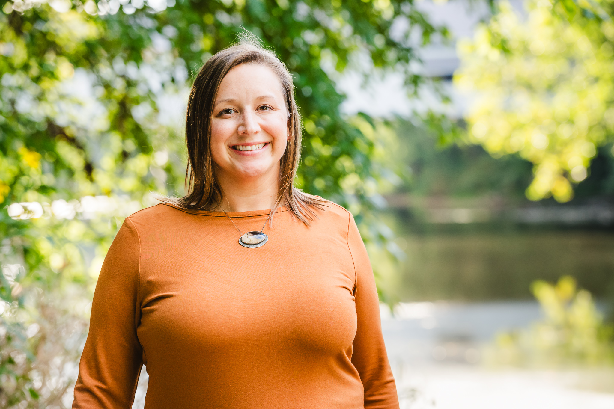 Emily Teagarden smiling beside the water